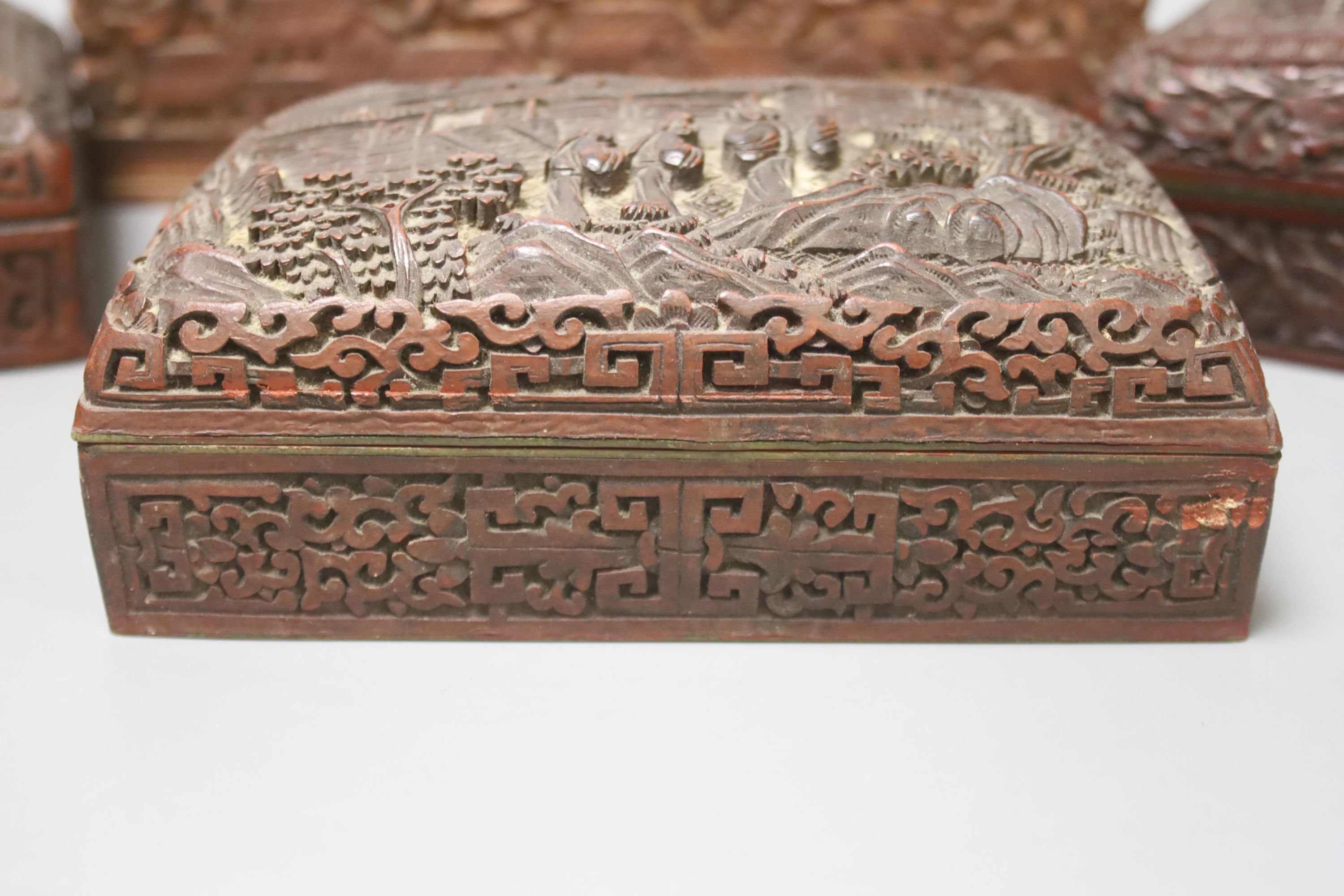 Four Chinese carved wood boxes, largest 24 x 12cm